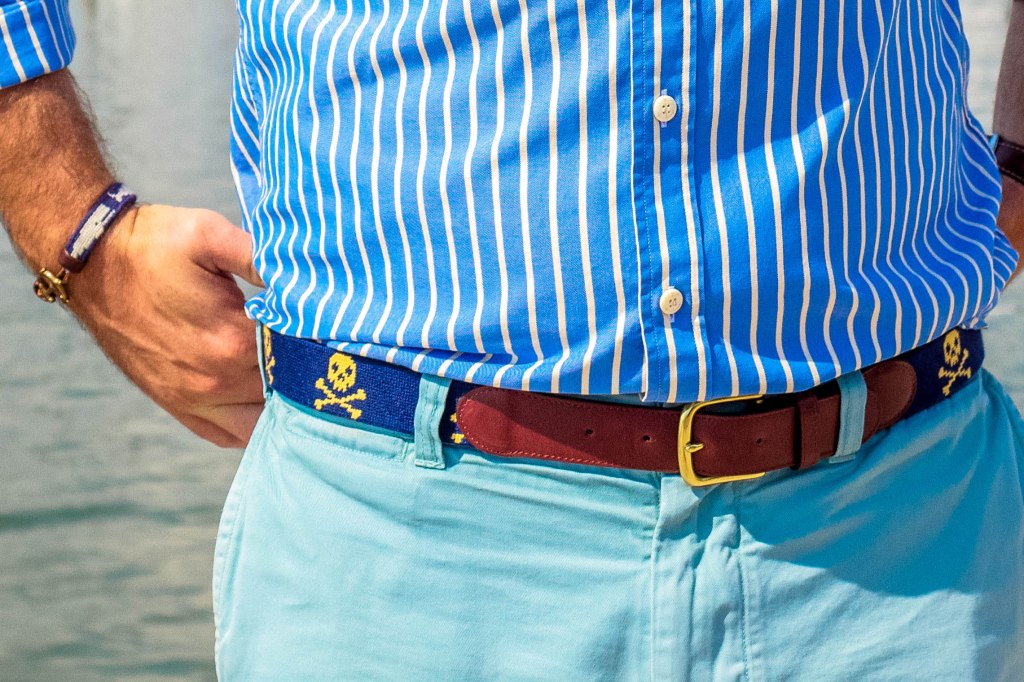 Tucker Blair Skull & Crossbones belt paired with a Tucker Blair x KJP whale needlepoint bracelet